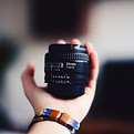 hand holding lens