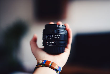 hand holding lens
