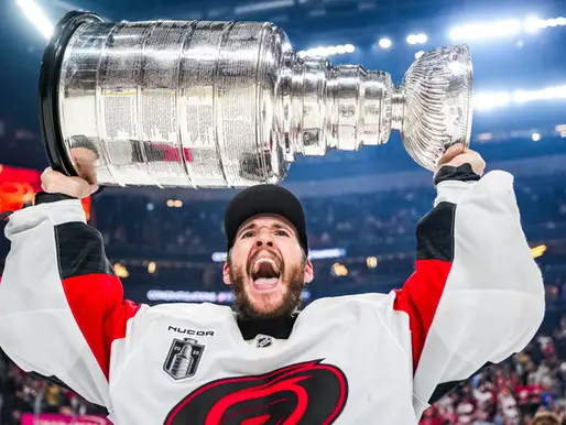 Brandon Bussi hoisting the Stanley Cup after winning the 2026 NHL Stanley Cup with the Carolina Hurricanes 