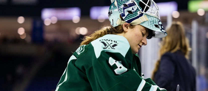 Aerin Frankel signing autographs after recording her sixth shutout of the season.
