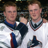 Daniel and Henrik Sedin after being drafted by the Vancouver Canucks in 1999