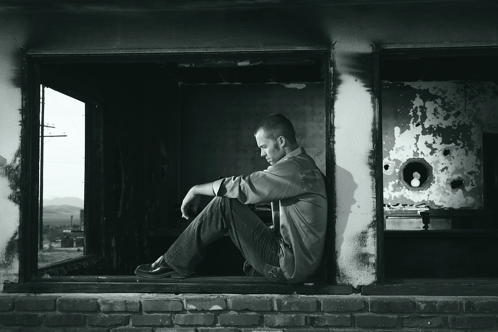 Man sitting in window - black and white image