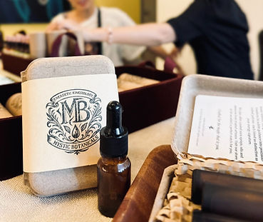 Potion Artisan muscle testing a client for her bespoke potion