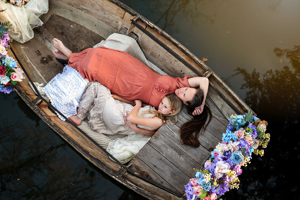 Mother and Child Laying down on Rowboat for Motherhood Family Portraits