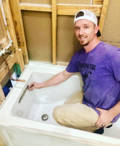 master plumbers son tim installing new tub spout.jpg