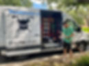 Mike in front of the plumbinator van holding some pipe