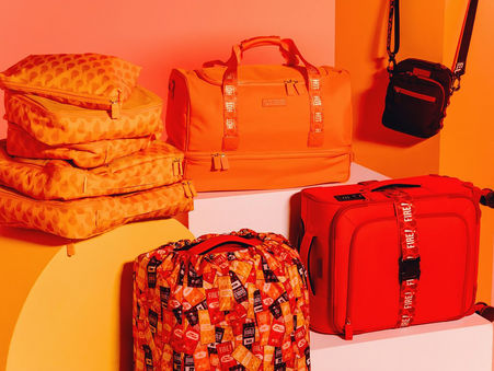 Taco Bell's New Luggage Collection Is Inspired By Their Hot Sauce Packets