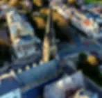 this-view-looks-down-at-an-aerial-view-of-a-town-2026-03-18-07-47-37-utc.webp