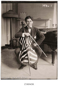Young cellist J. Balaban poses with his instrument