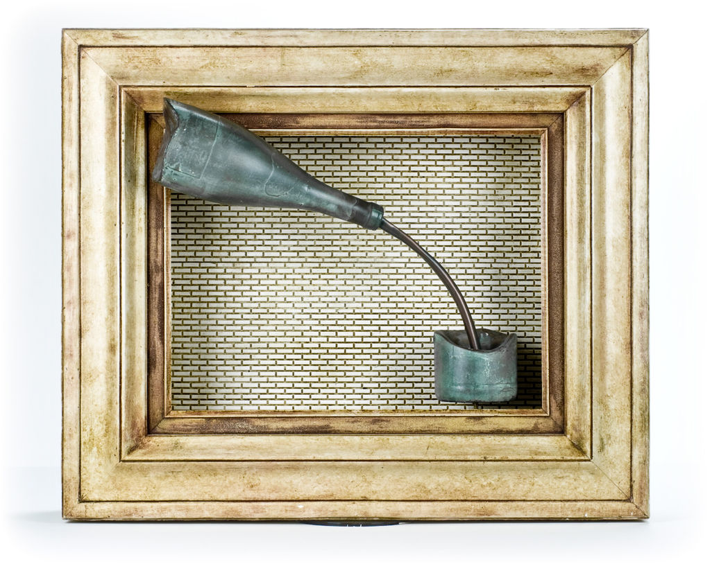 Framed sculpture: metallic horn-like form