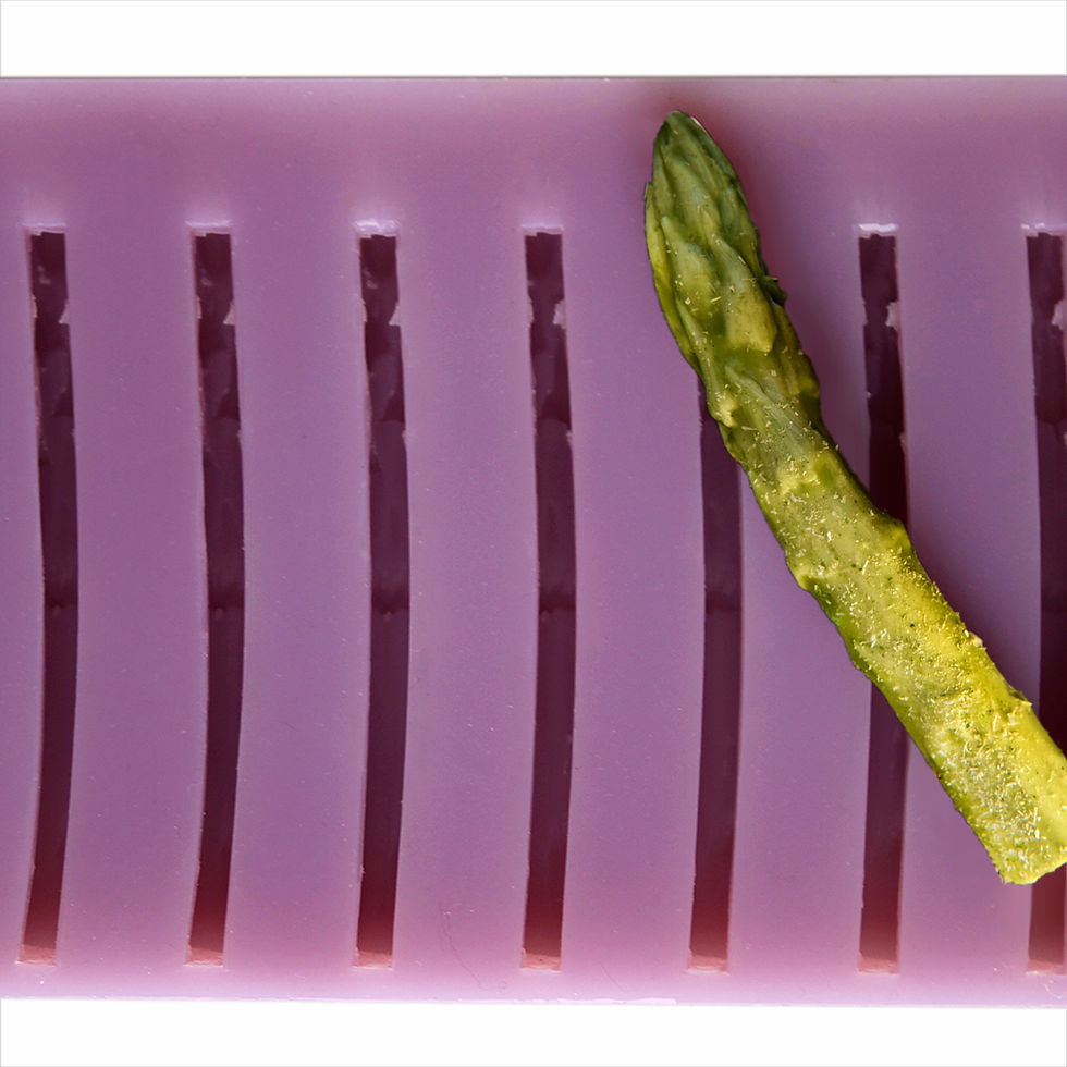 Asparagus silicone mold, showcasing a smooth, green gelatin dish with asparagus spears embedded | Chicago Culinary FX