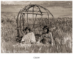 Two Crow women sit near a wickiup