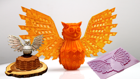 Owl figurine with intricate wings, a smaller owl figurine on a wooden base, and a silicone mold of an owl