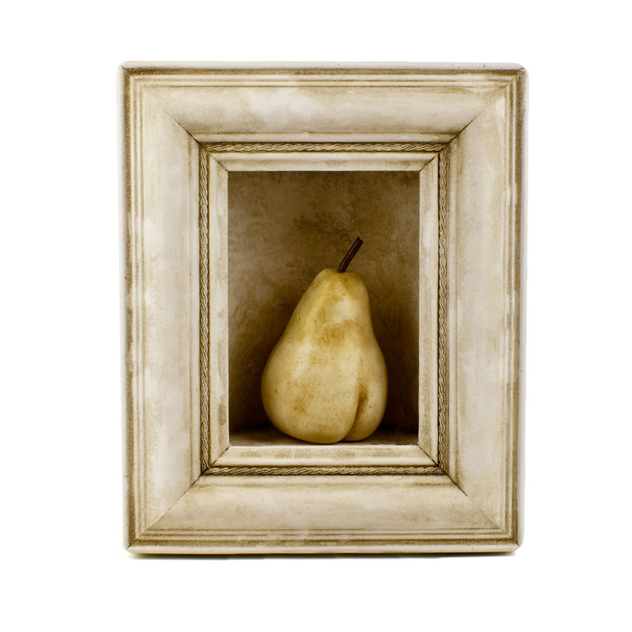 Carved pear sculpture in frame