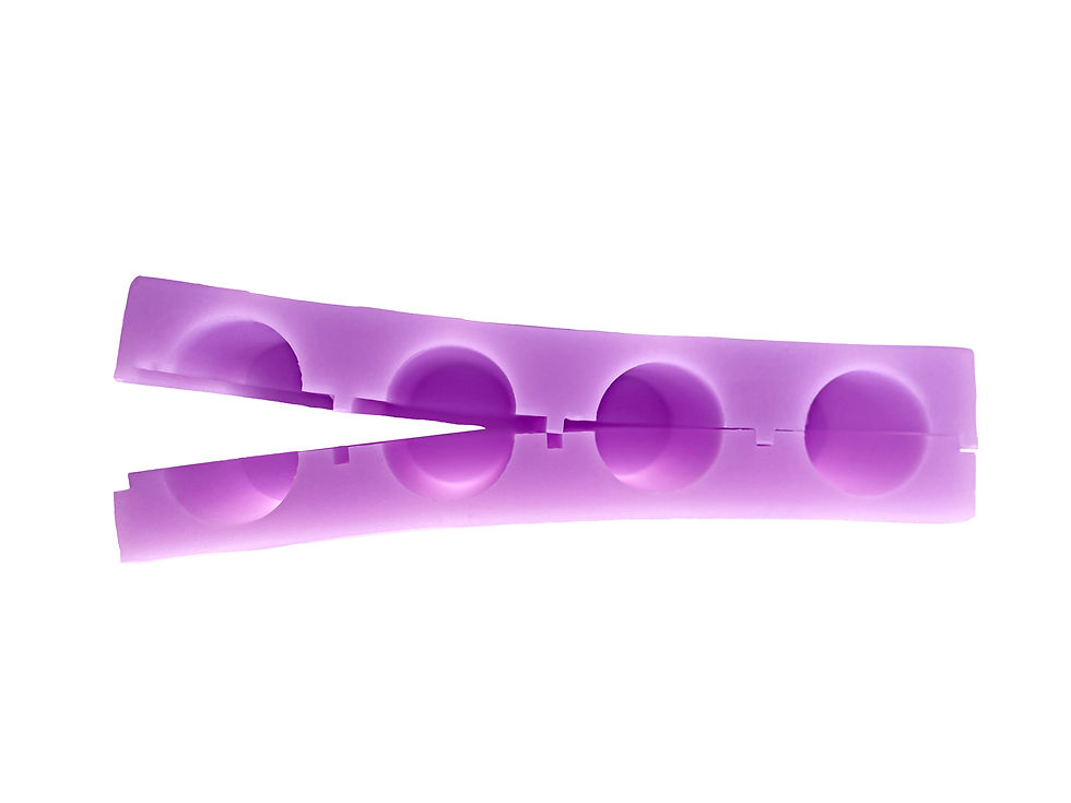 Purple silicone mold for making oval candies