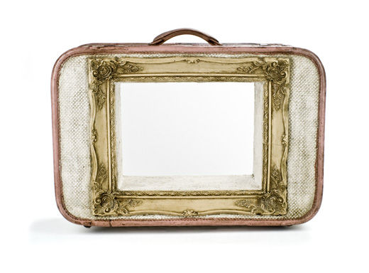 Antique suitcase with ornate frame
