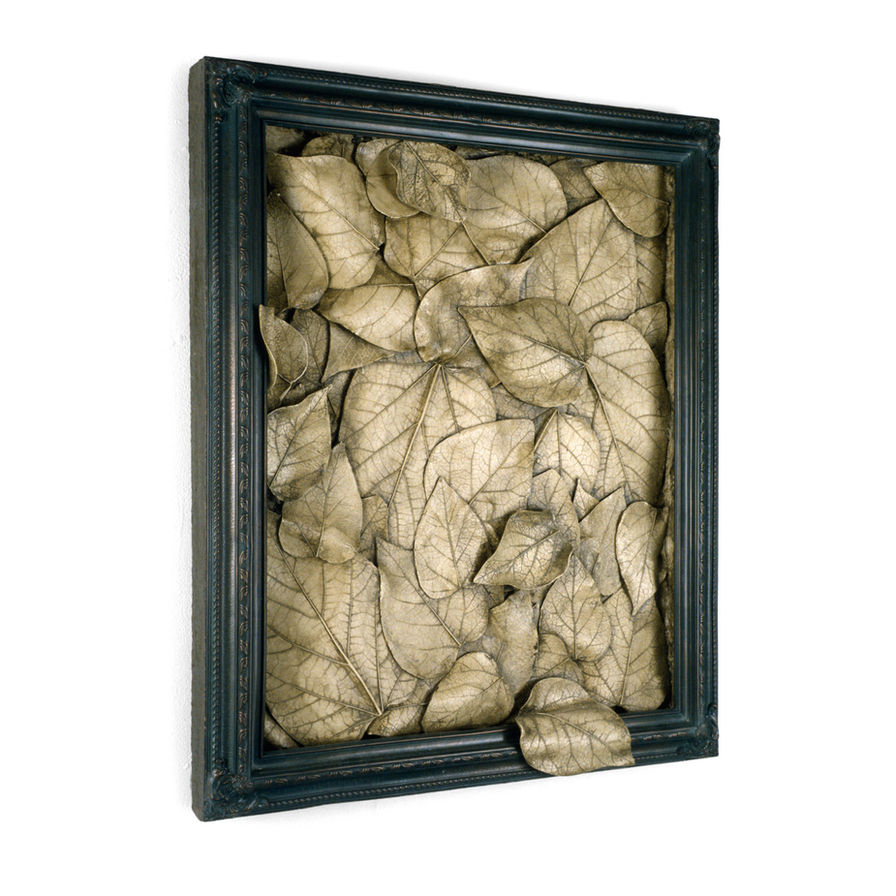 Intricate leaf sculptures in framed artwork