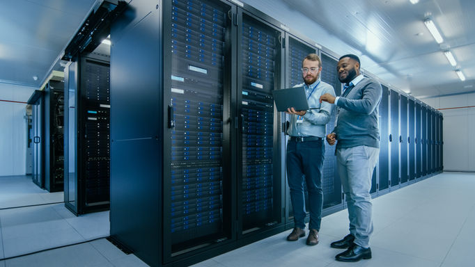 Two technicians in a data centre