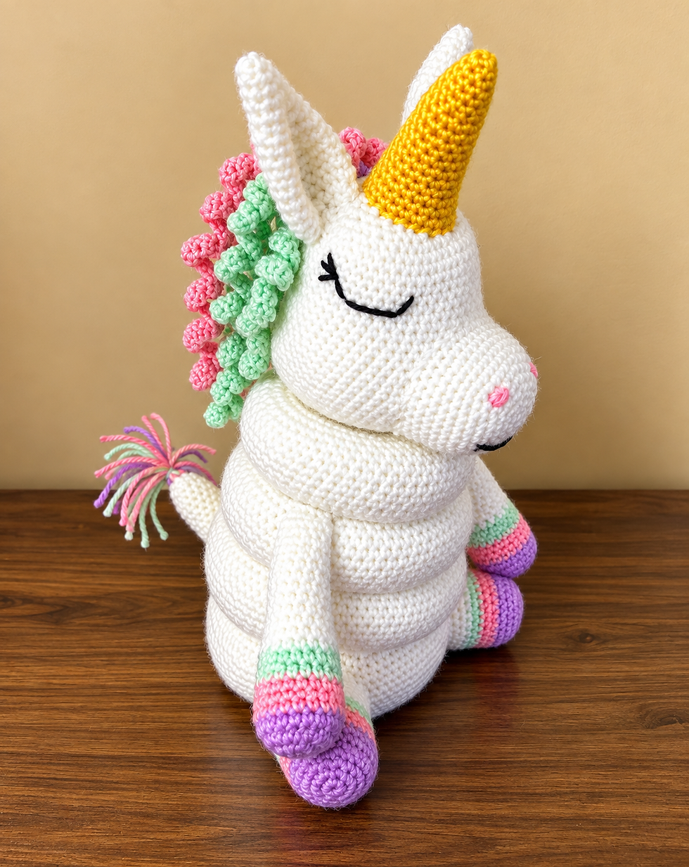 Colourful crochet unicorn ring stacking toy amigurumi pattern