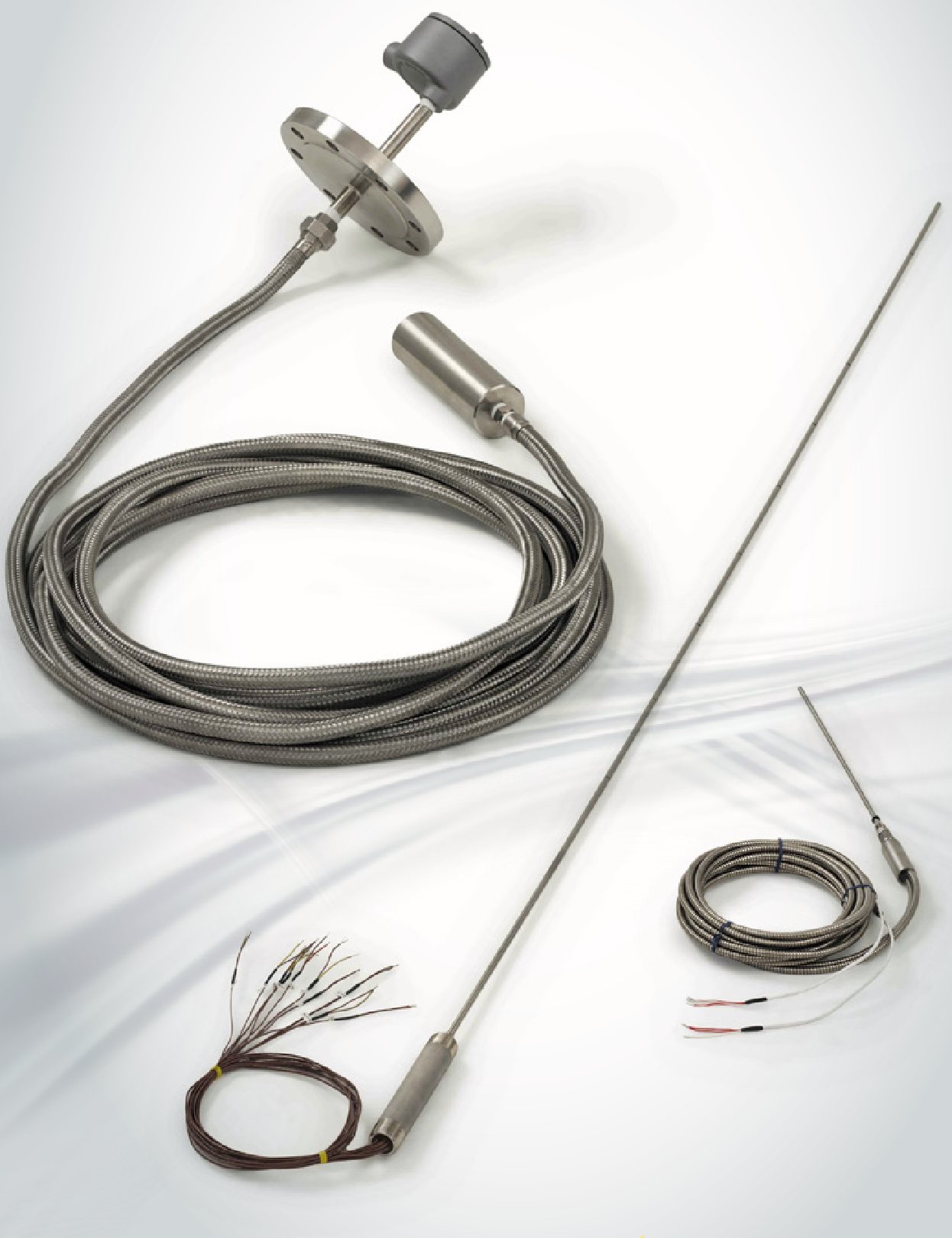 Pyromation multi-point temperature sensors with flange and braided leads