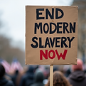 End Modern Slavery Now protest sign