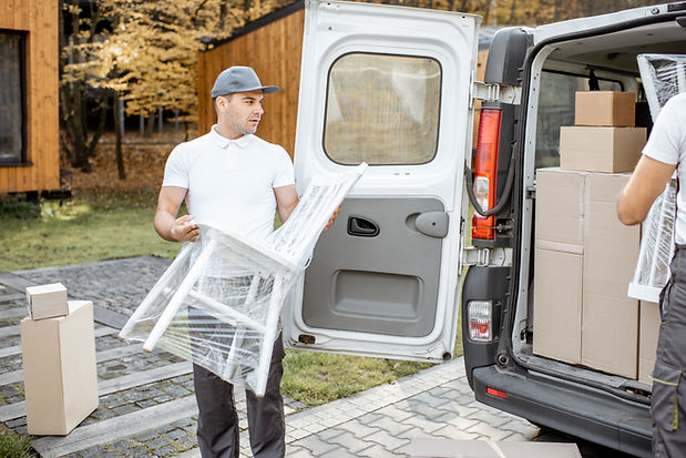 delivery-company-employees-unloading-cargo-van-veh-2025-03-15-16-17-25-utc.jpg