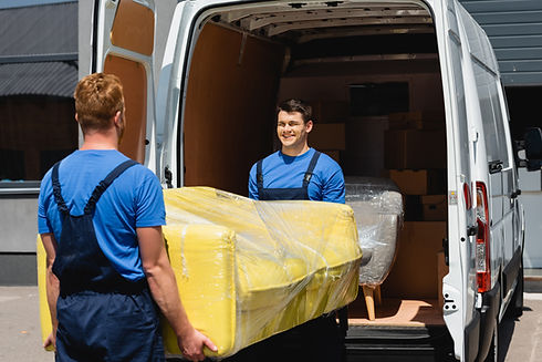 selective-focus-of-movers-holding-sofa-in-stretch-2024-11-17-23-58-10-utc.jpg