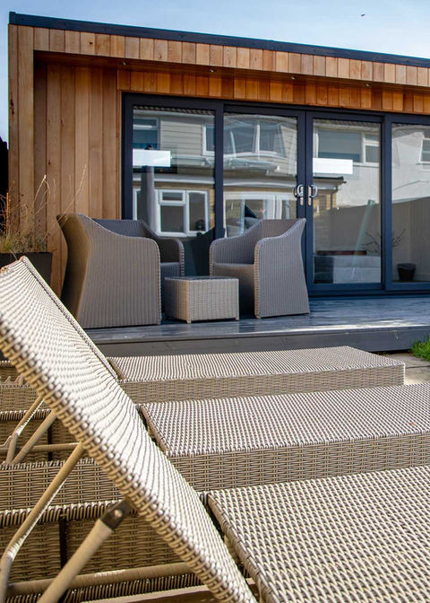 Large garden office with a. bespoke garden room - deck chairs