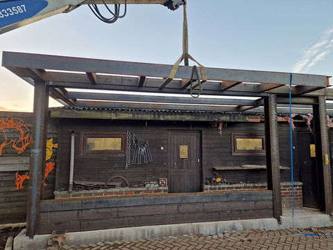 Outdoor steel frame going over an existing workshop - alternative project by bespoke builds