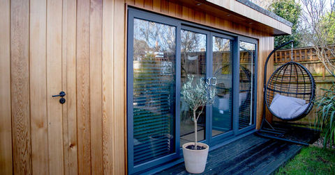 Luxury garden office with hanging egg chair