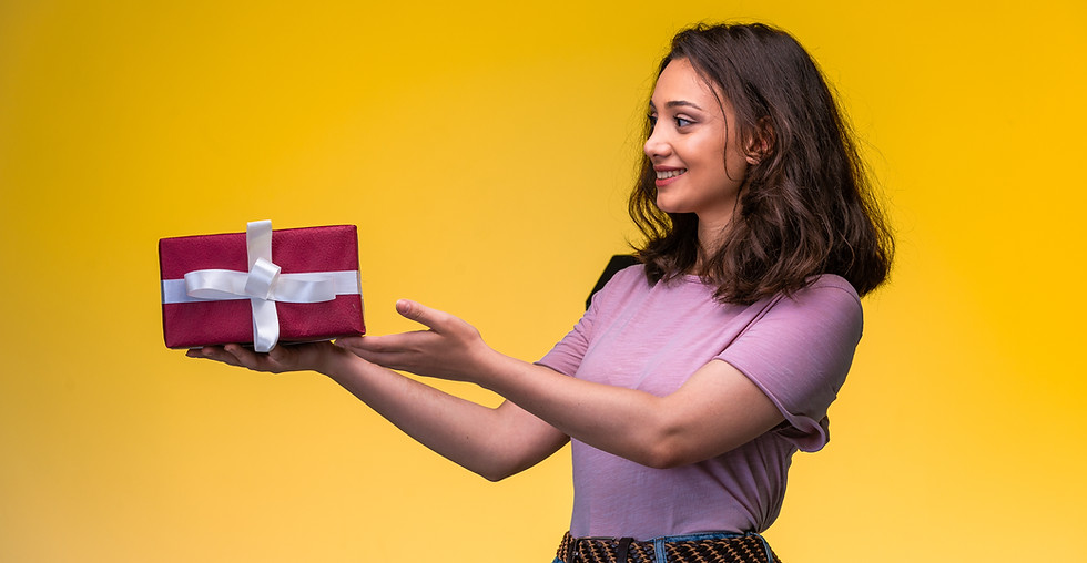 young-girl-holding-gift-box-her-anniversary-looks-happy.jpg