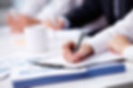 close-up-busy-businesswoman-writing.jpg