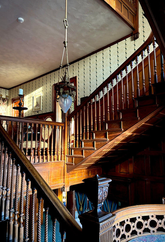 A long staircase in a Victorian home