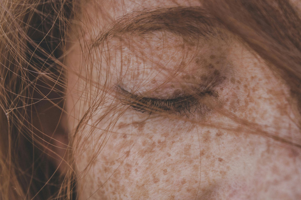 Close up image of a woman with her eyes closed