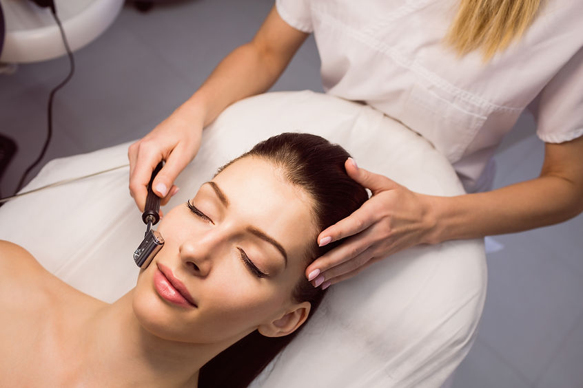 dermatologist-performing-laser-hair-removal-patient (2).jpg