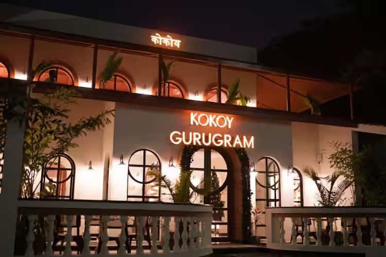 Kokoy is Gurgaon's fresh all-day cafe and specialty coffee spot at Plot 703, opposite Ansal Plaza, Sector 23. It blends cozy comfort dining with premium brews, wood-fired pizzas, pastas, burgers, sandwiches, and desserts. The place focuses on quality coffee, aesthetic vibes, and community feel for every mood, brunch, catch-ups, or slow evenings. It's family-friendly, couple-perfect, and great for friends or solo hangs. With warm interiors and an inviting setup, it's quickly becoming a go-to in Gurgaon for coffee lovers and casual meals.
