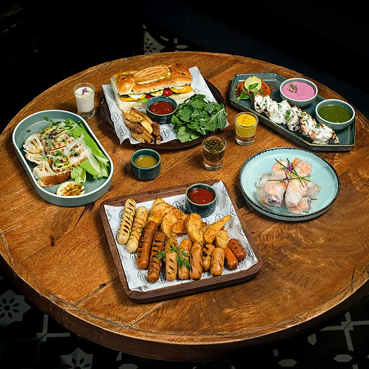 Here are a few highly ordered dishes and craft brews that capture its bold blend of Bombay’s vibrant energy and Berlin’s edgy brewing culture:        Mini Blue Cheese Kulchas    Enoki Mushroom Pockets    English Cheddar Chicken Kebab    German Apple Cake     Tropical Twist IPA