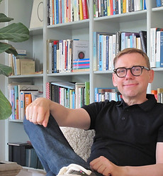 kevin scott psychotherapy on chair bookcase.JPG