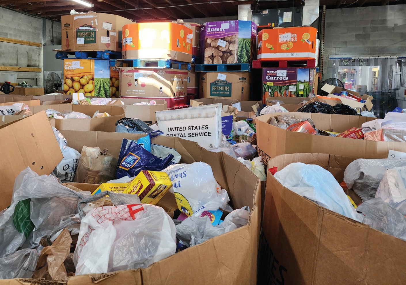 Boxes of food-drive donations in Interfaith Emergency Services’ warehouse.