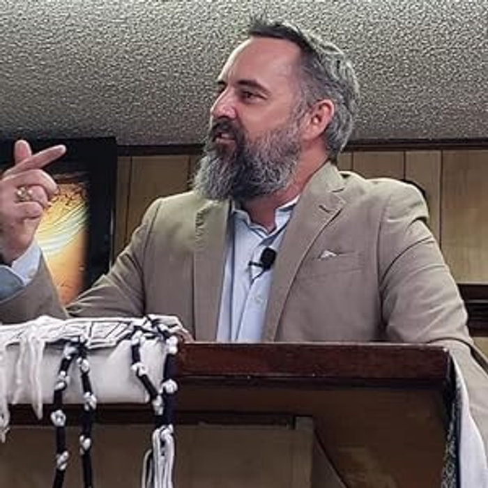 Chris Cahill speaking at a lectern