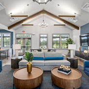 Wide view angle of the living room and kitchen spaces in the Clubhouse at Cedar Hill.
