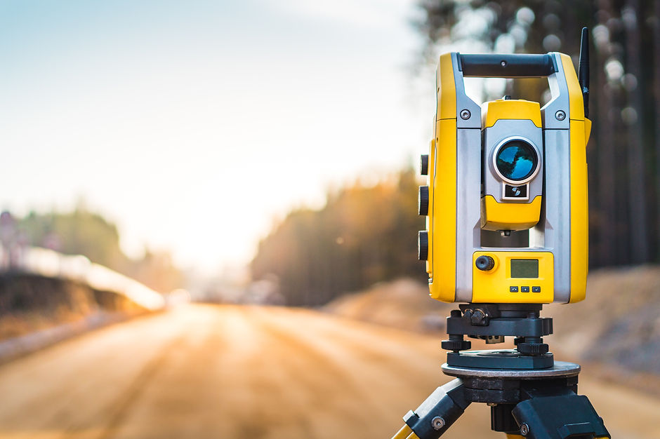 Surveyors equipment (theodolite or total positioning station) on the construction site of
