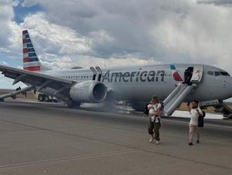 American Airlines Flight 3023 were forced to evacuate after smoke and flames erupted from the aircraft’s landing gear during taxi for takeoff at Denver International Airport.