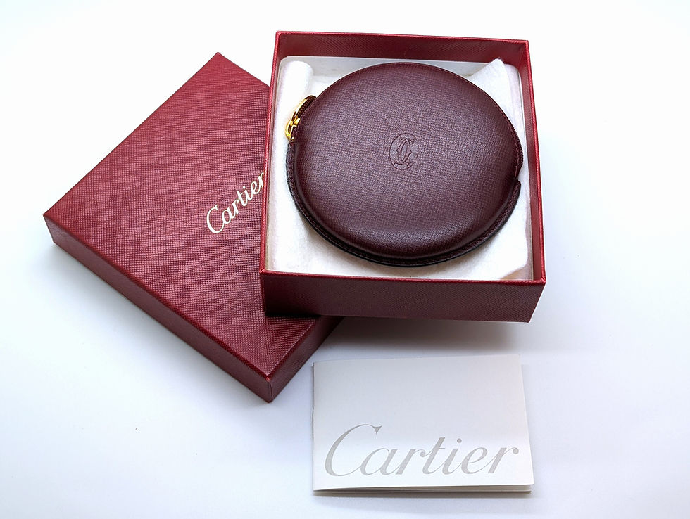 Cartier pouch in the classic round profile burgundy cowhide leather, embossed with Cartier's iconic “Double C” purse