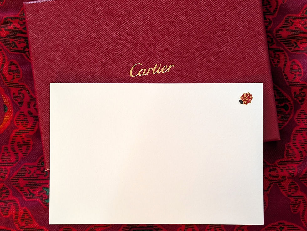 Stationery from Cartier's Jardin collection featuring La Coccinelle the charming little red ladybugs