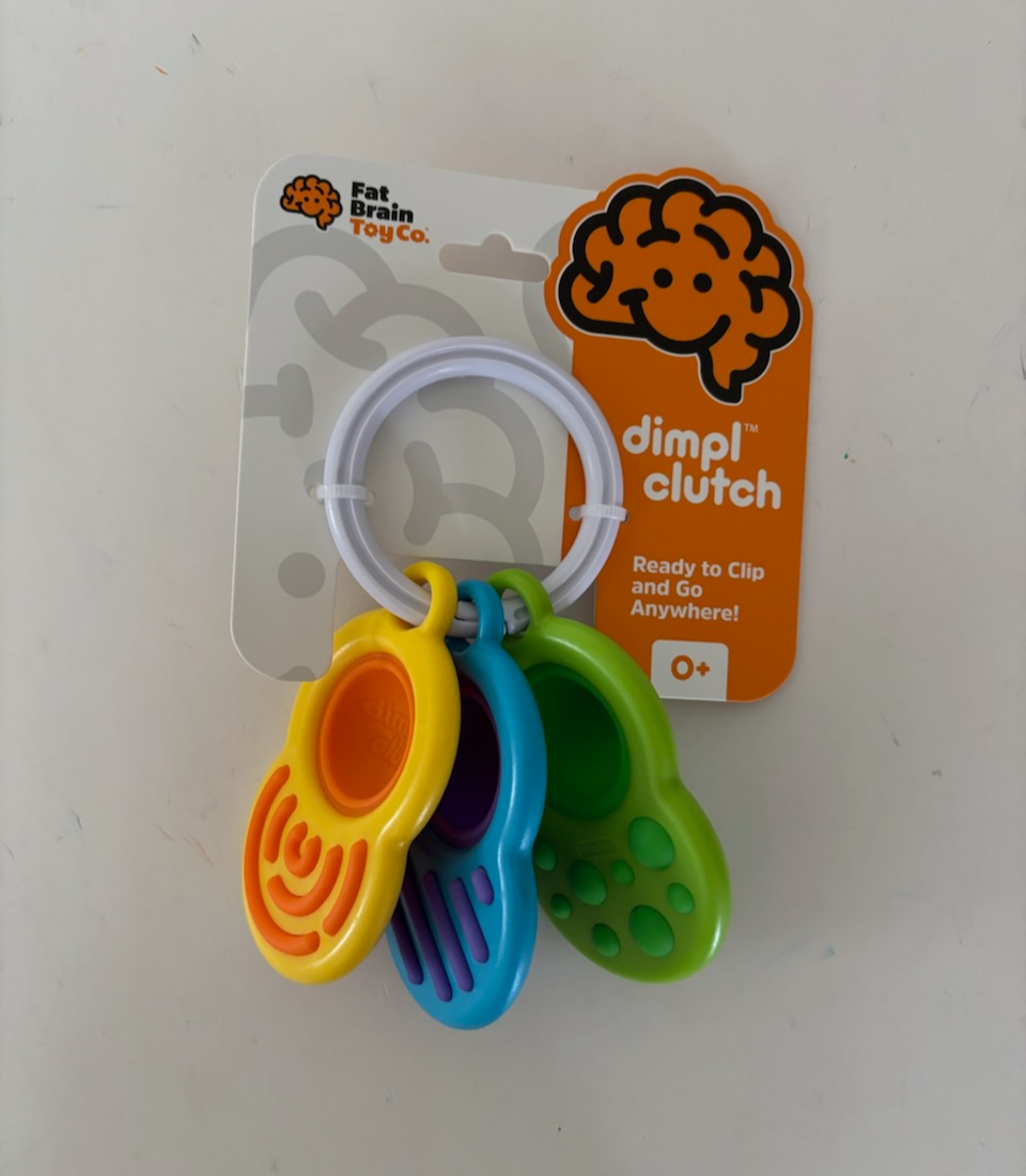 Fat Brain dimpl clutch UPC #810074270953