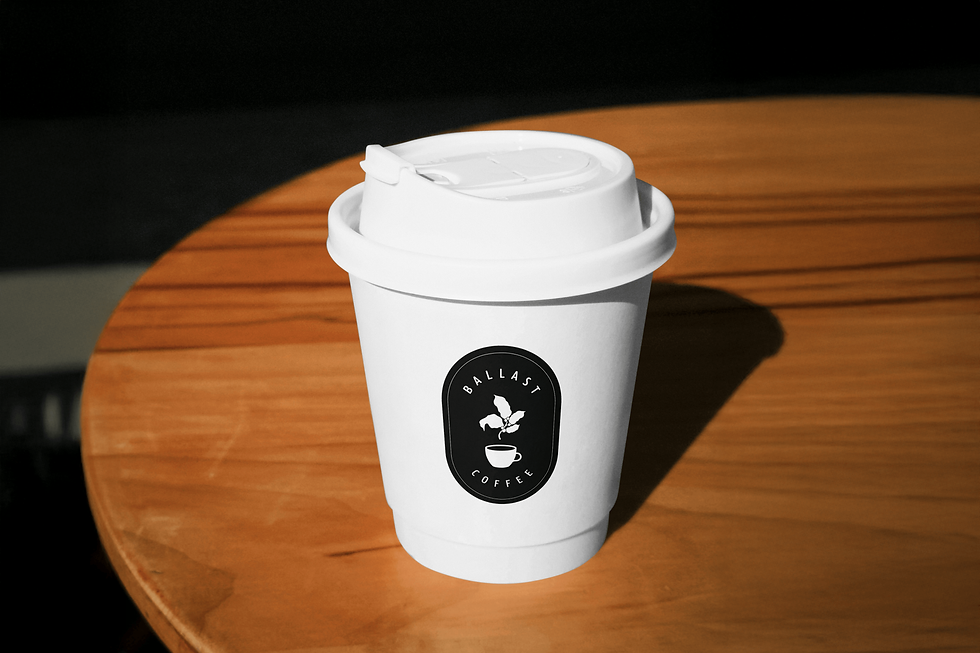 Free Coffe Cup on a Table PSD Mockup.png