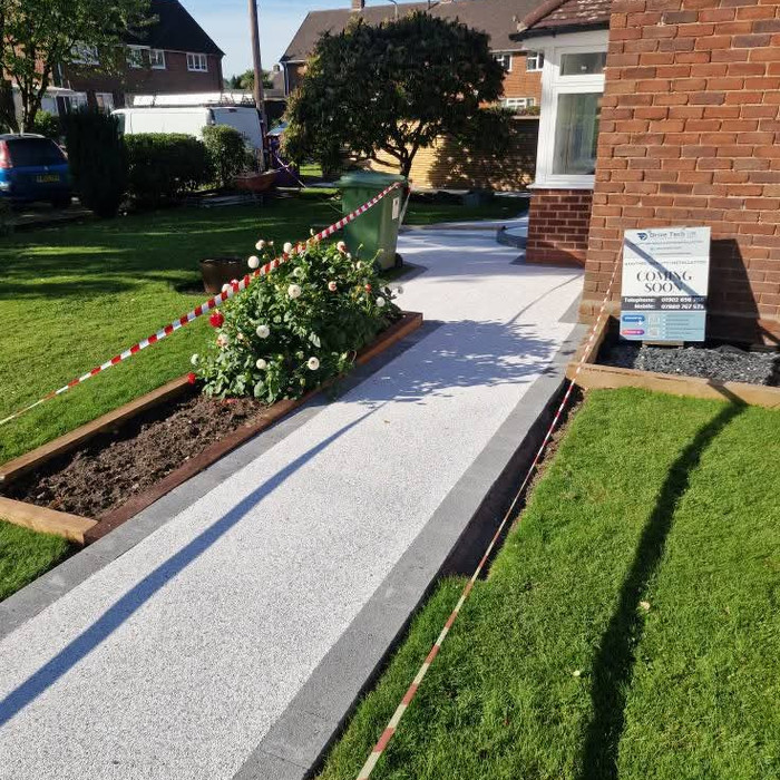 Resin bound garden path with lawn border and gate access