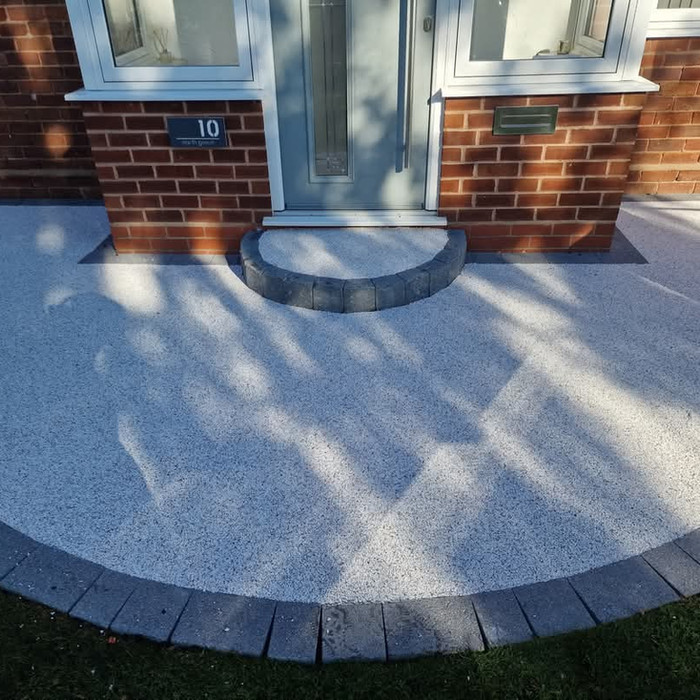 Resin bound front entrance with round brick step