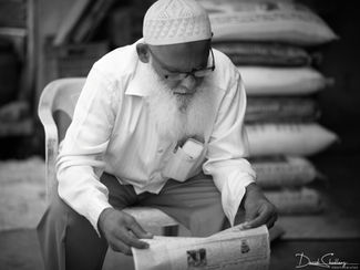 Man Reading Paper